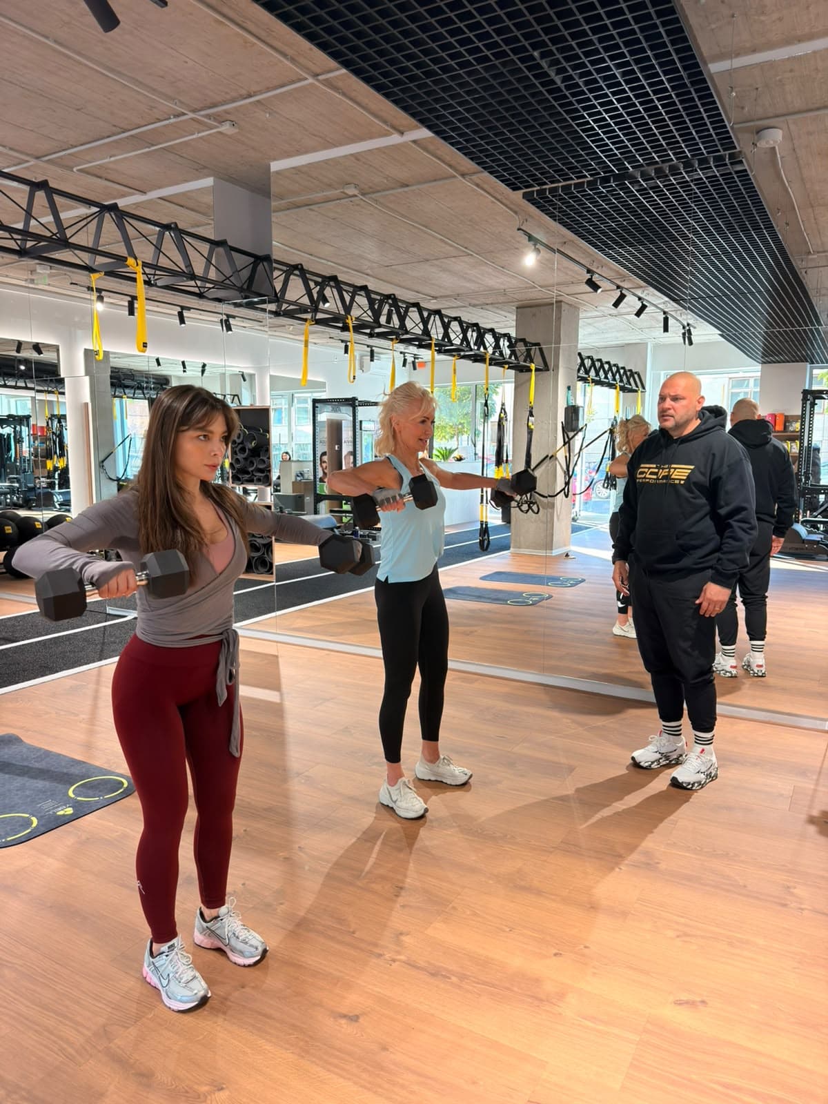 Small group training session with dumbbells